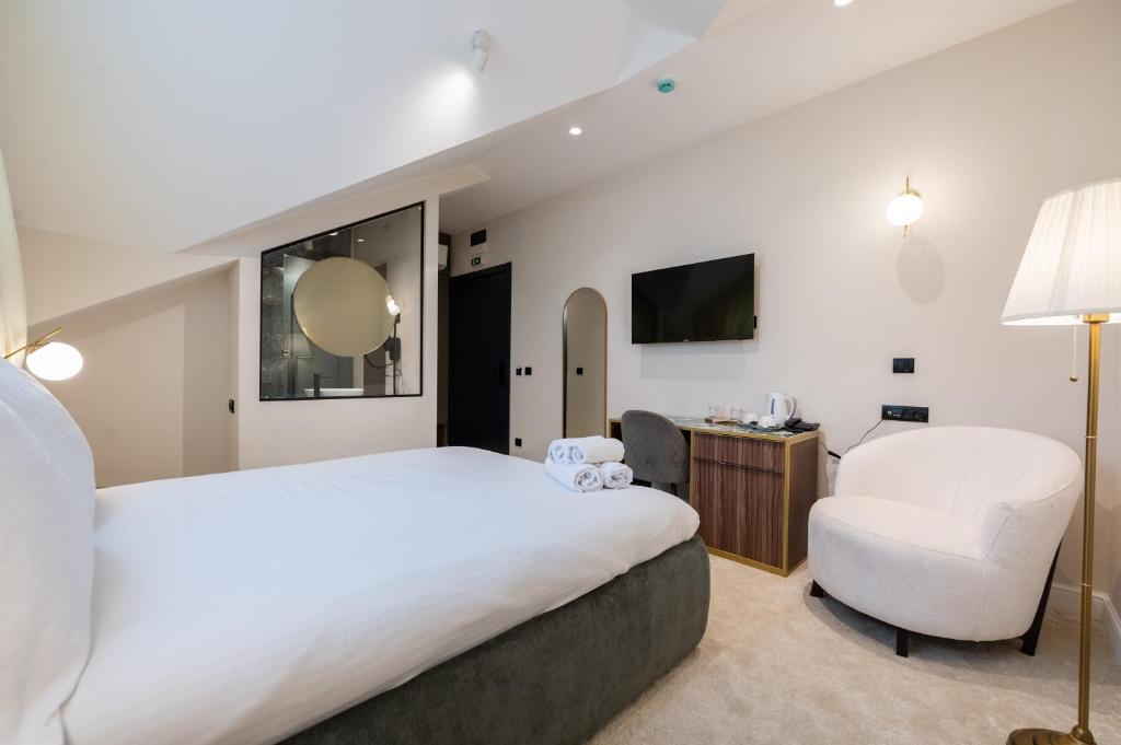 TV a/nebo společenská místnost v ubytování Boem Exclusive Rooms Skadarlija