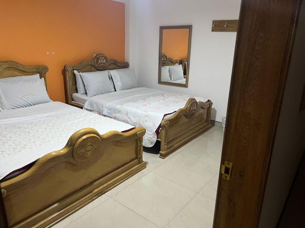 Postel nebo postele na pokoji v ubytování Hotel Bosque Chapinero