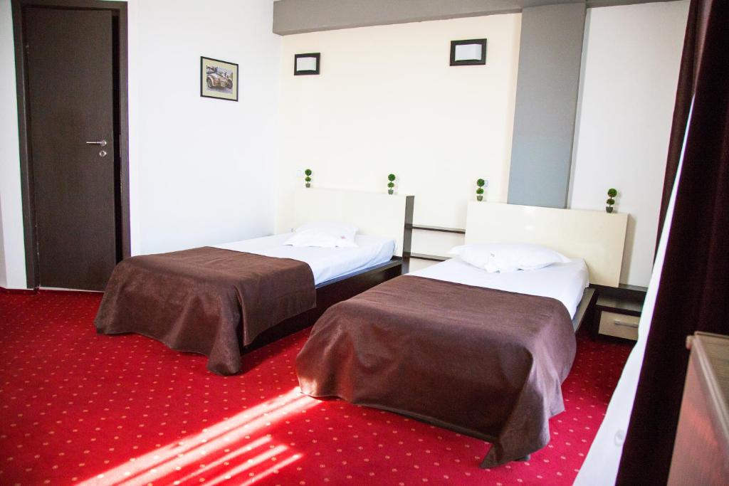 Postel nebo postele na pokoji v ubytování GP Hotel