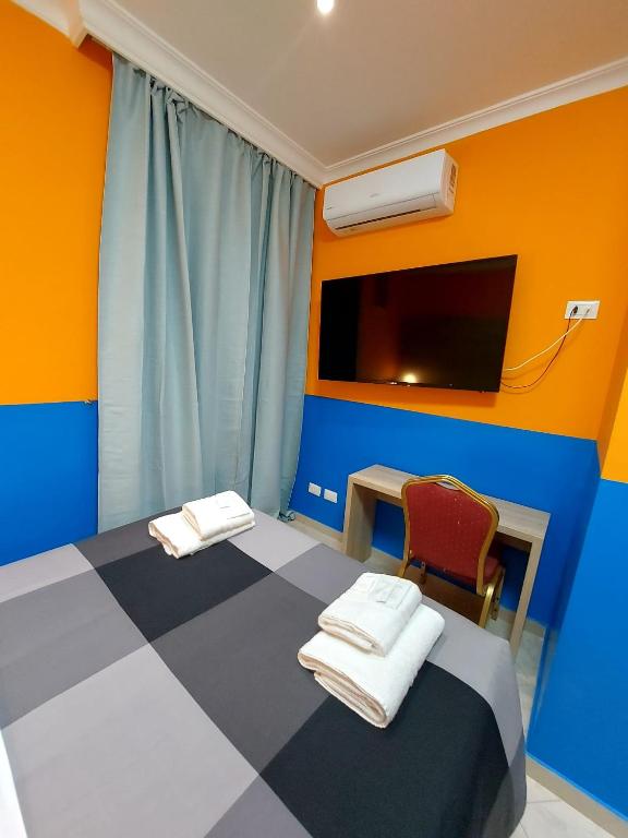Postel nebo postele na pokoji v ubytování Hotel Positano