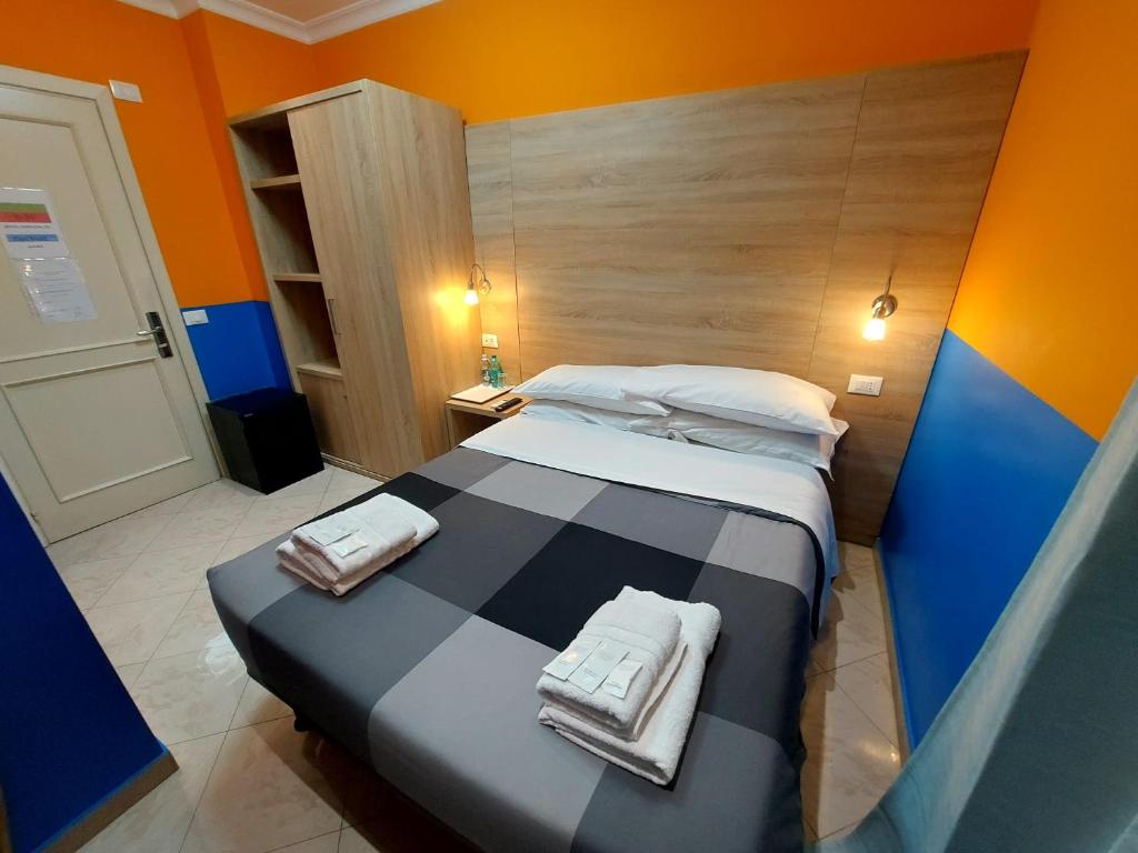 Postel nebo postele na pokoji v ubytování Hotel Positano