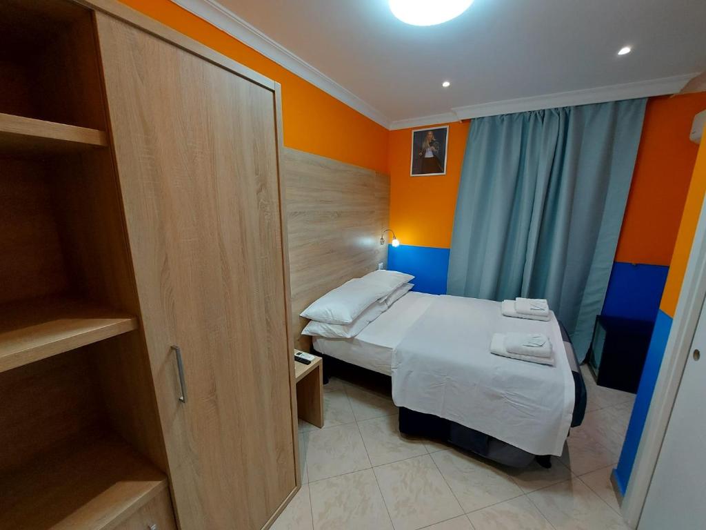 Postel nebo postele na pokoji v ubytování Hotel Positano