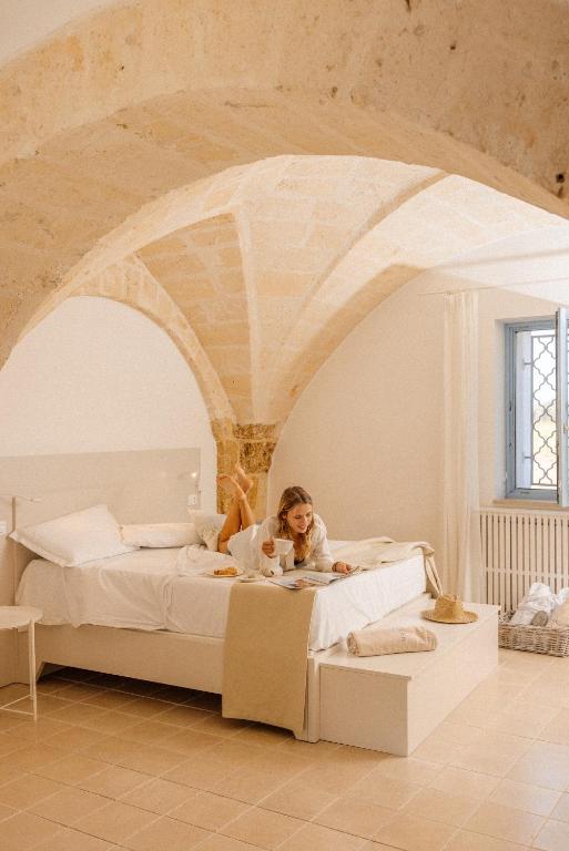 Postel nebo postele na pokoji v ubytování Masseria Malvindi
