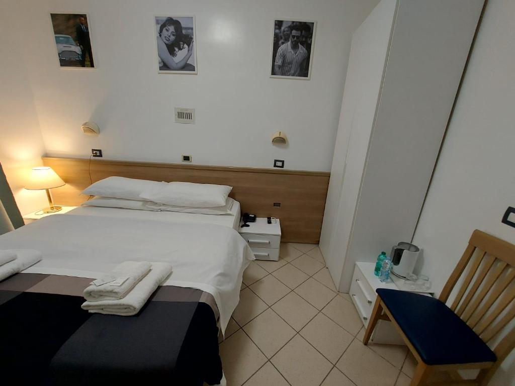 Postel nebo postele na pokoji v ubytování Hotel Positano