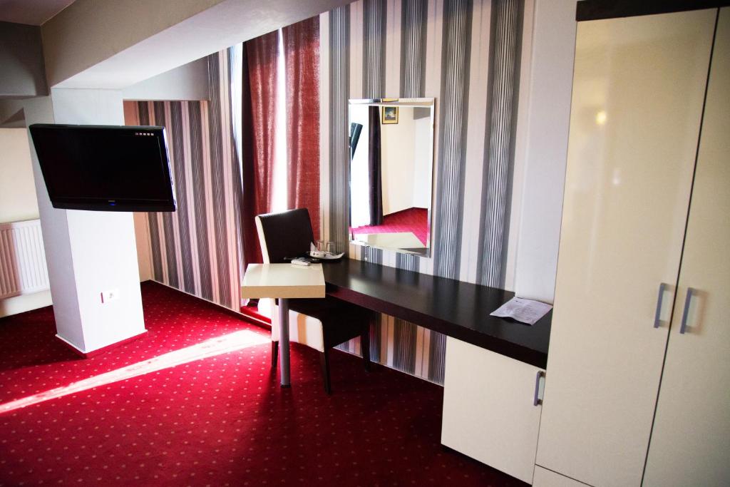 TV a/nebo společenská místnost v ubytování GP Hotel