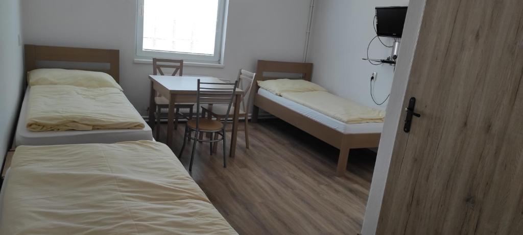 Postel nebo postele na pokoji v ubytování Penzión Enbra