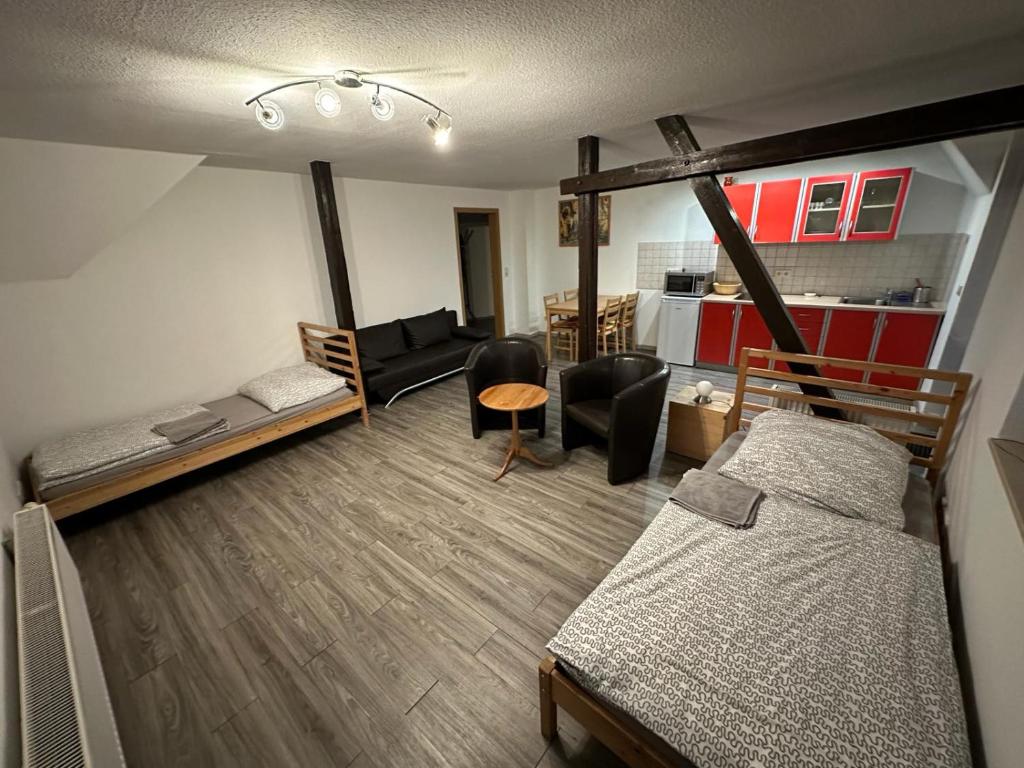 a room with a bed and a living room at Apartment Emilia in Leipzig