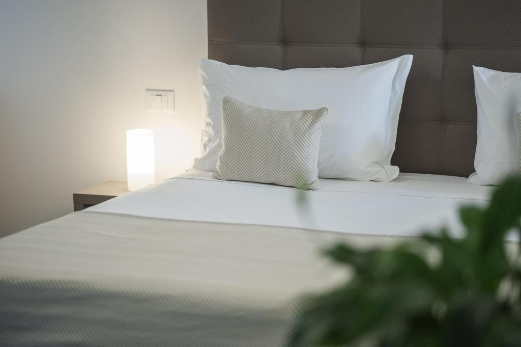 Posteľ alebo postele v izbe v ubytovaní Hotel Studio Inn Centrale & Milano Urban Padel
