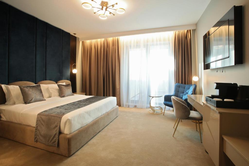Postel nebo postele na pokoji v ubytování Hotel Artemis