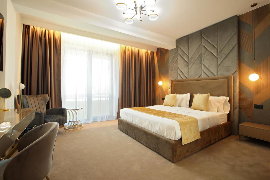 Postel nebo postele na pokoji v ubytování Hotel Artemis