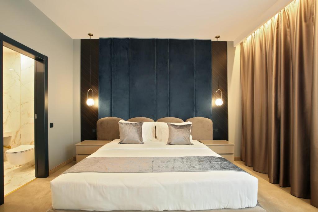 Postel nebo postele na pokoji v ubytování Hotel Artemis