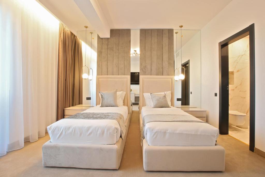Postel nebo postele na pokoji v ubytování Hotel Artemis