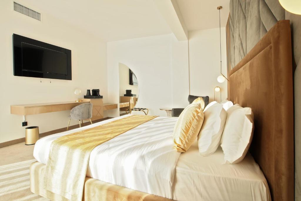 Postel nebo postele na pokoji v ubytování Hotel Artemis