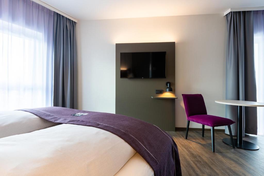 Postel nebo postele na pokoji v ubytování Holiday Inn-the niu, Wave Karlsruhe Oststadt by IHG