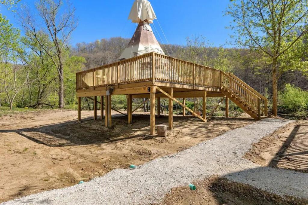 a wooden gazebo with a roof on top at Furnished Teepee/Glamping/Red River Access/King Bd in Stanton