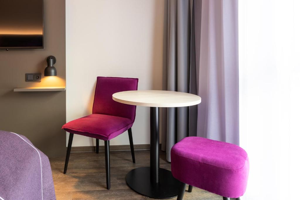 Posezení v ubytování Holiday Inn-the niu, Wave Karlsruhe Oststadt by IHG