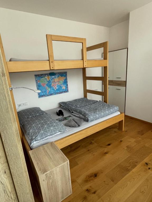 two bunk beds are in a room with at Apartmán “U nás v podkroví“ v Rezidenci Klostermann, Železná Ruda 24 in Železná Ruda