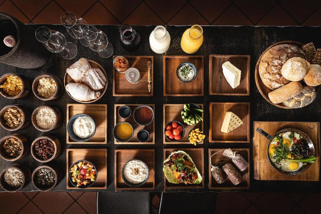 a table with many different plates of food on it at MEIER Hilzhof in Hilzhofen