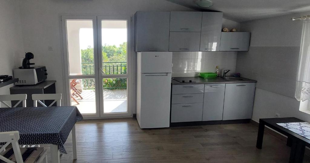 Kuchyň nebo kuchyňský kout v ubytování Apartments Basina
