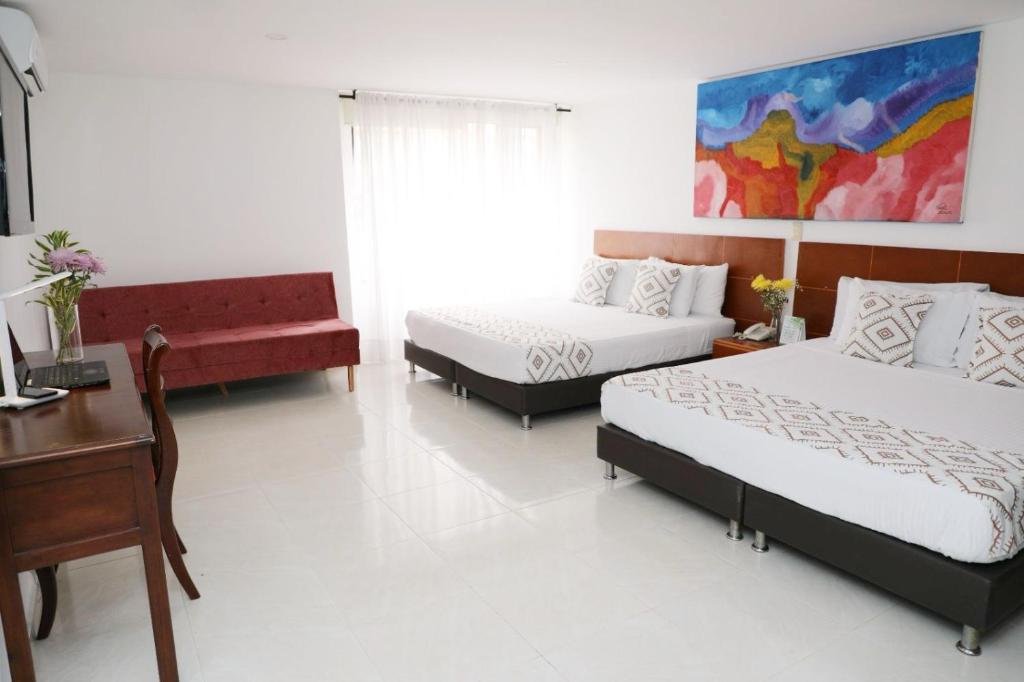 Postel nebo postele na pokoji v ubytování Hotel Guane