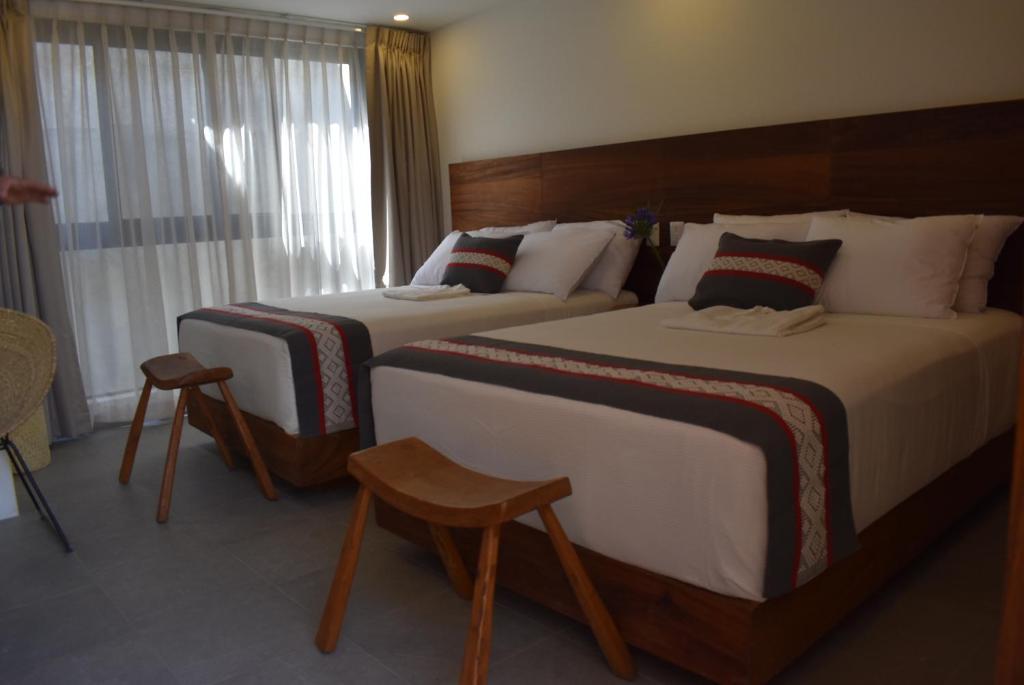 Postel nebo postele na pokoji v ubytování Punta Agave Suites
