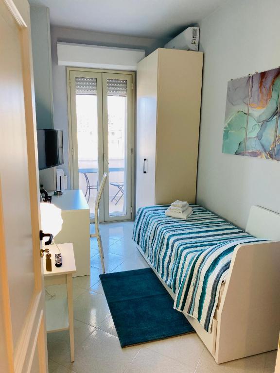 Łóżko lub łóżka w pokoju w obiekcie B e B Le Terrazze sul mare