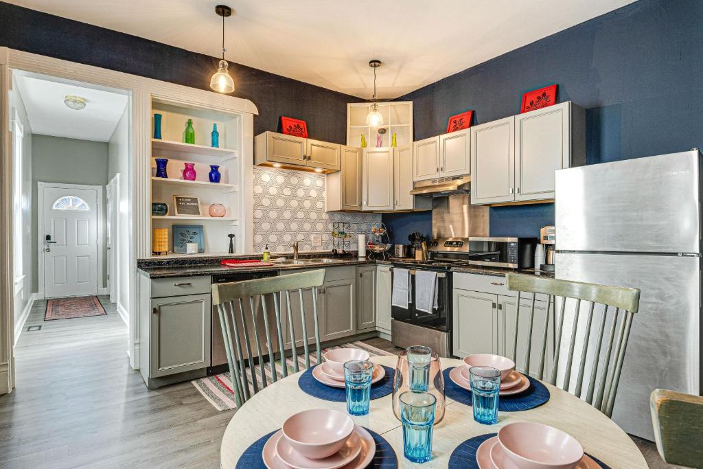 a kitchen with a table and chairs and a refrigerator at Pet-Friendly Indianapolis Retreat Near City Center in Indianapolis