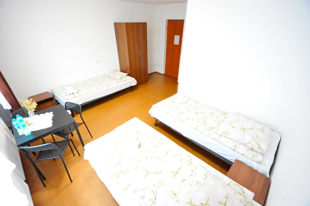 Posteľ alebo postele v izbe v ubytovaní Twój Hostel Bytom