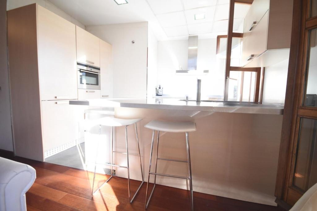 Kuchyň nebo kuchyňský kout v ubytování Bello Apartamento en la Plaza del Tossal