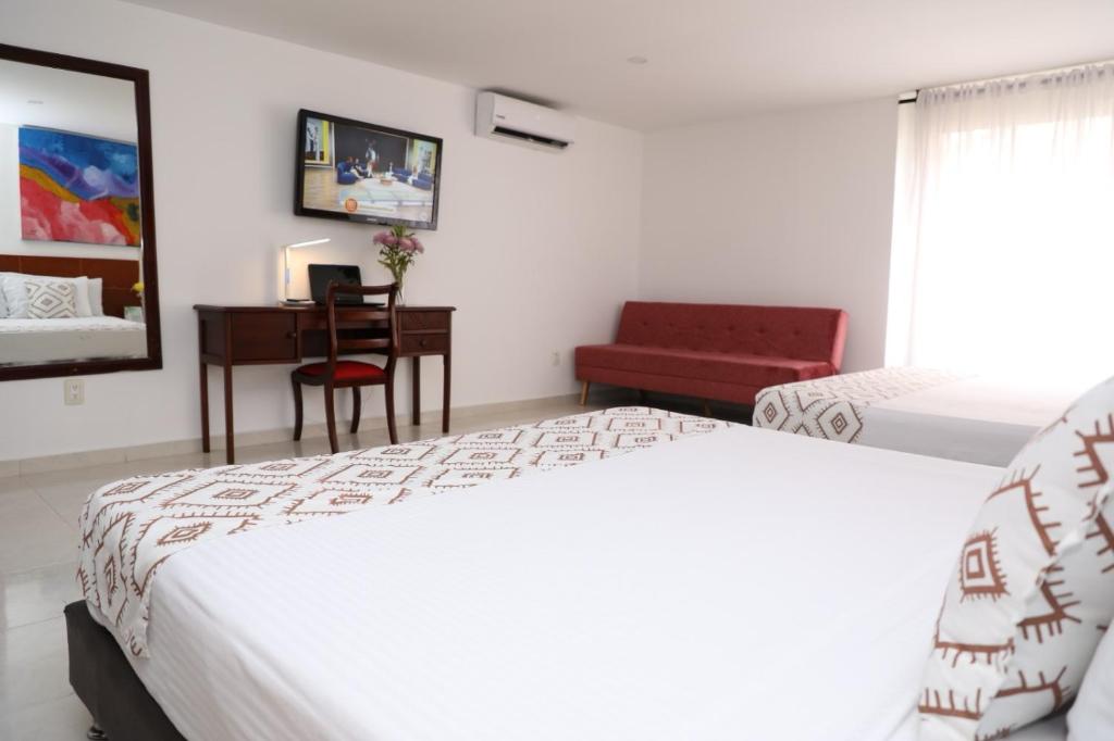 Postel nebo postele na pokoji v ubytování Hotel Guane