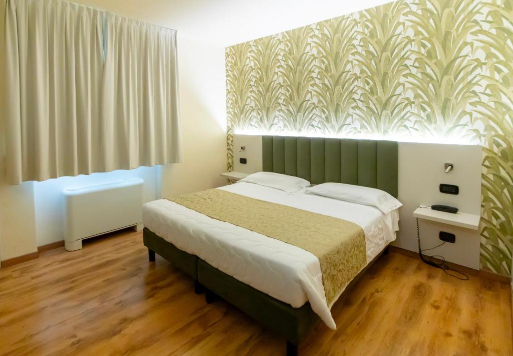 Postel nebo postele na pokoji v ubytování Hotel Riz B.B