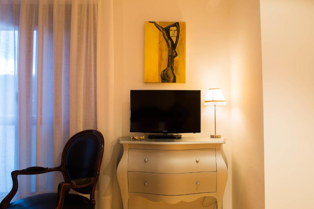 TV a/nebo společenská místnost v ubytování Casa de la Cadena