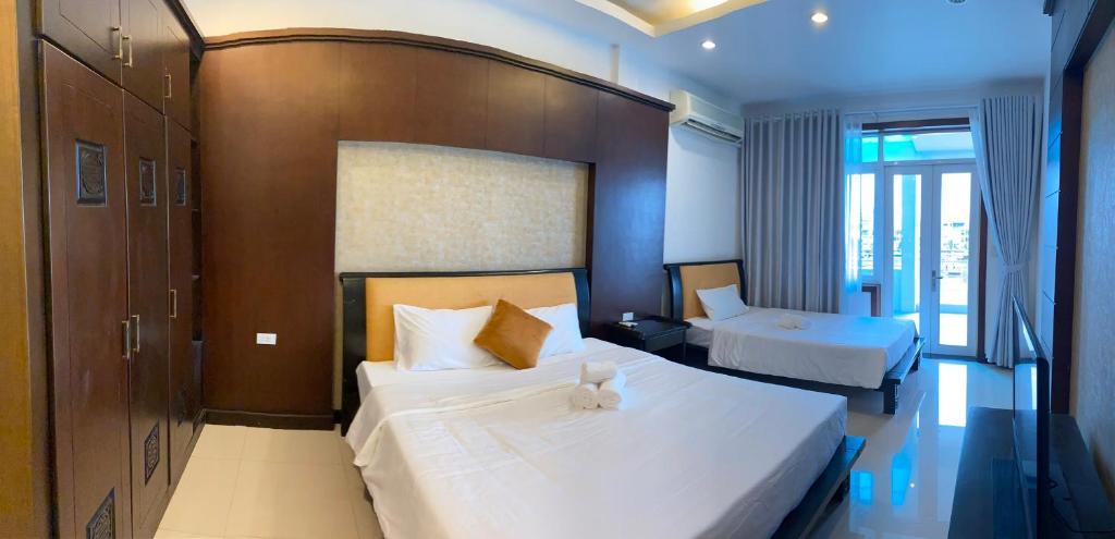 Кровать или кровати в номере SOCHU HOUSE- Tuần Châu Homestay & Coffee
