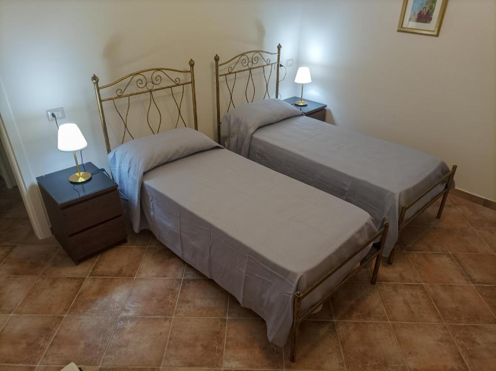 Postel nebo postele na pokoji v ubytování Casa delle Campane