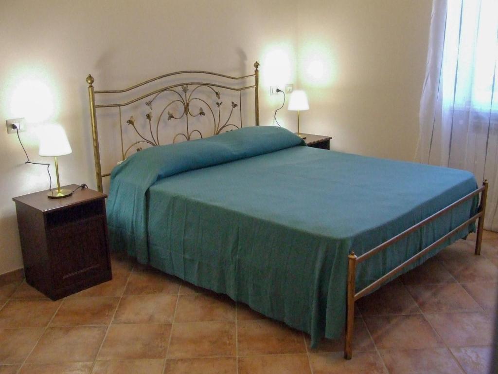 Postel nebo postele na pokoji v ubytování Casa delle Campane