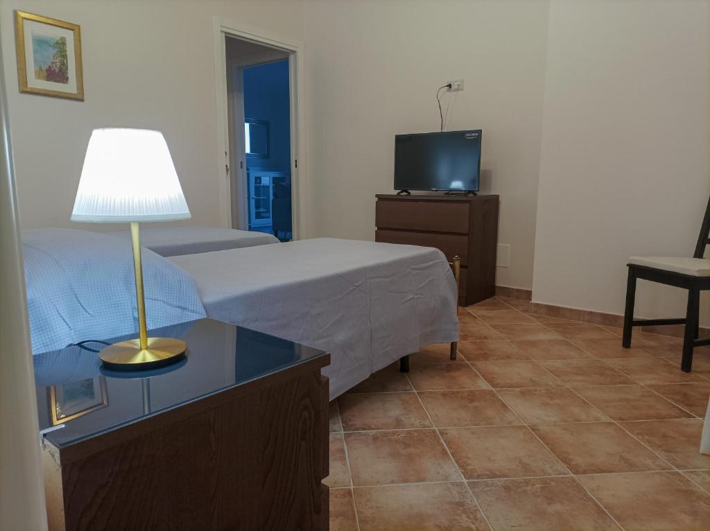 Postel nebo postele na pokoji v ubytování Casa delle Campane