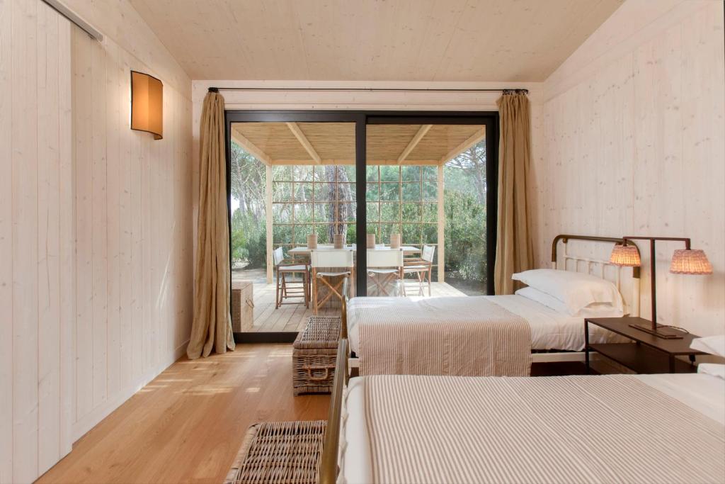 Un pat sau paturi într-o cameră la Retreat & Glamping Terre di Sacra in Toscana