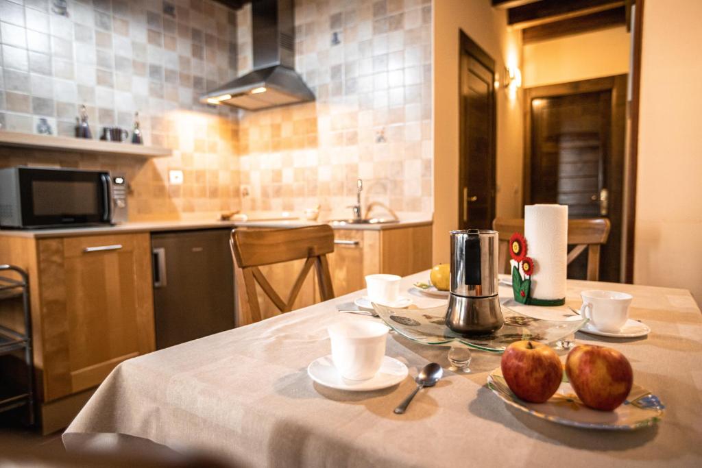 A kitchen or kitchenette at apartamentos rurales marrubiu-playa de Poo
