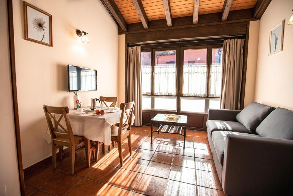 A seating area at apartamentos rurales marrubiu-playa de Poo