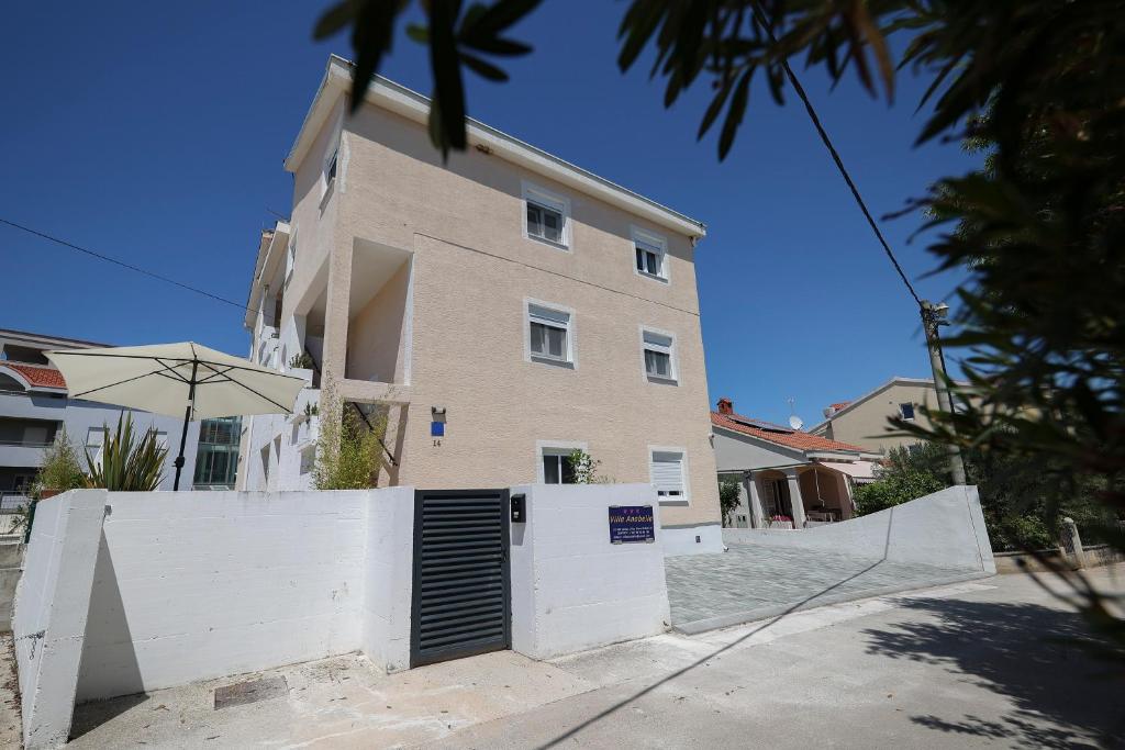a building with a gate in front of it at Villa Anabella II in Zadar