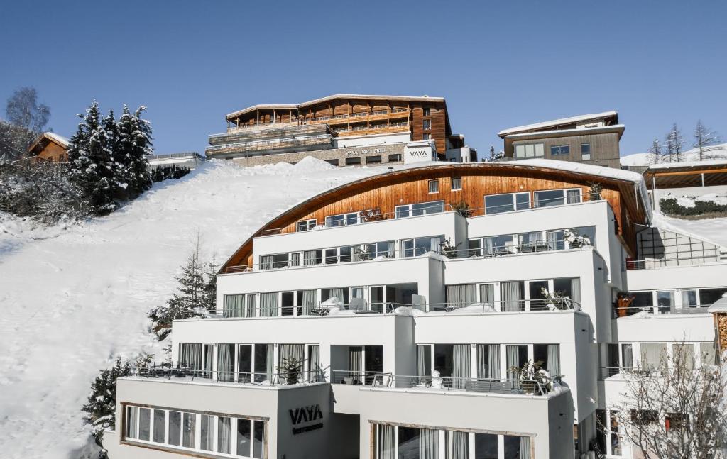 a building on top of a snow covered hill at VAYA Terrazena Serfaus in Serfaus