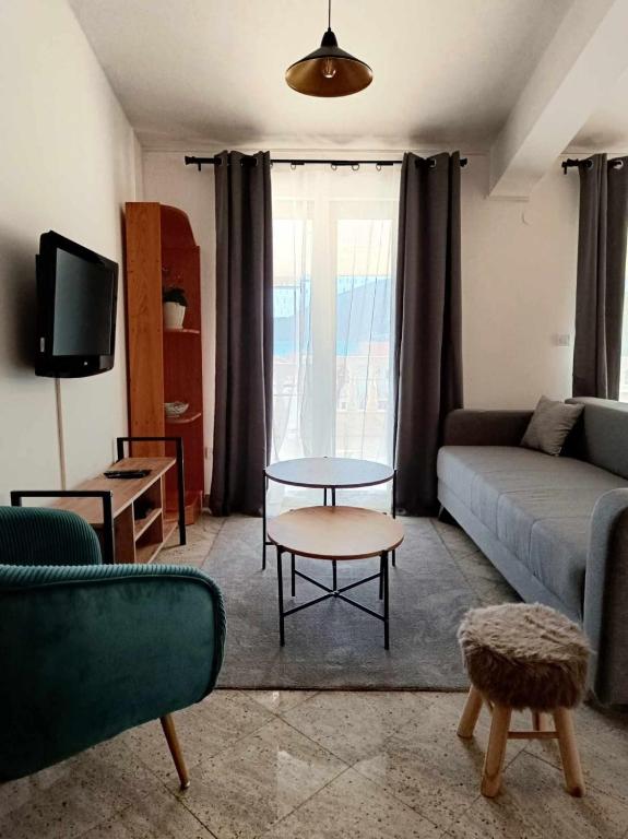 a living room with a couch and a table at Vila Pašić in Igalo