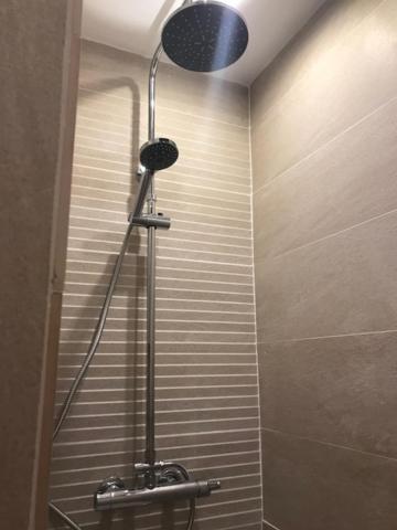 a shower stall in a bathroom with a shower at B&amp;B Au bois dormant chambres d hotes in Tillé