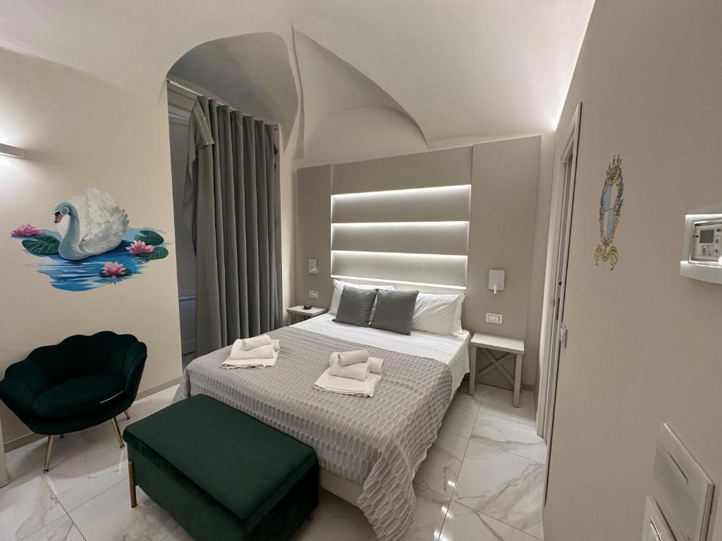 a bedroom with a bed with two towels on it at That's Amore Accommodation Tropea in Tropea