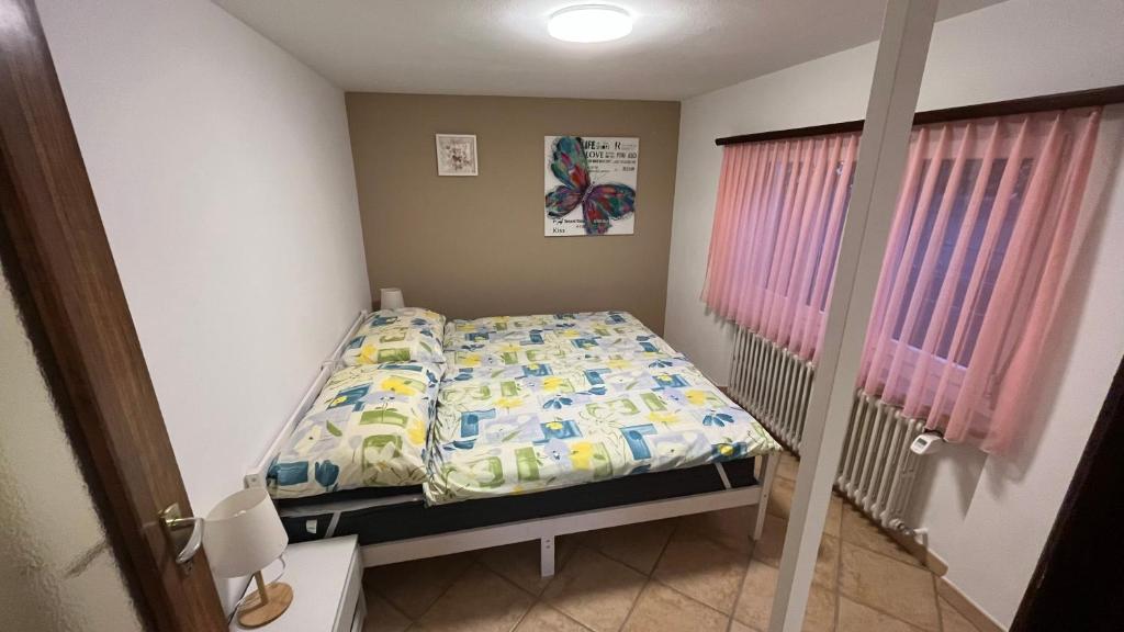 Postel nebo postele na pokoji v ubytování Ferienwohnung Casa Azalea