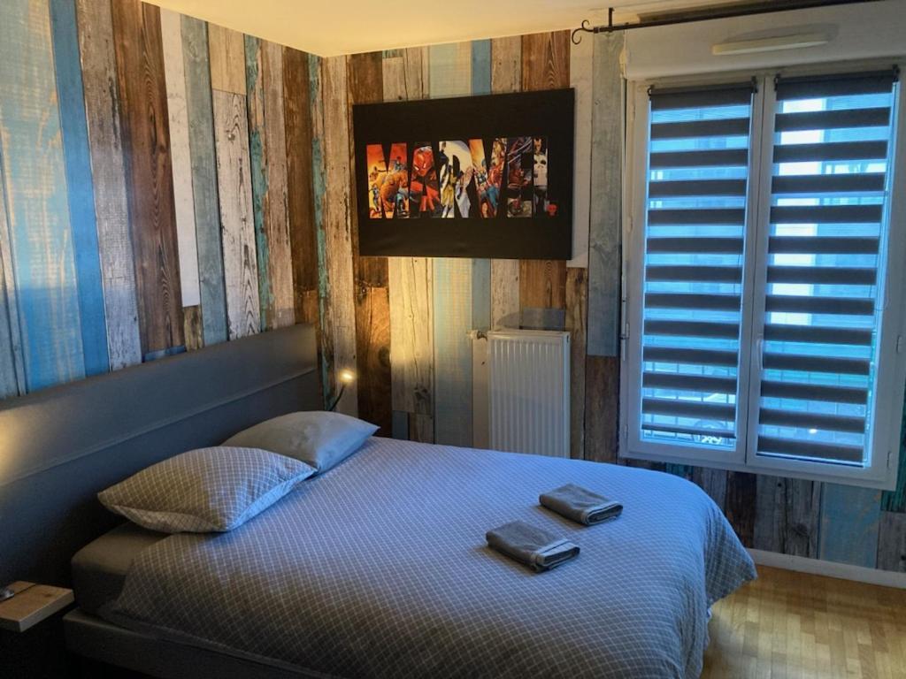 Postel nebo postele na pokoji v ubytování sweet appartement Disneyland Paris parking 300m station val d'Europe