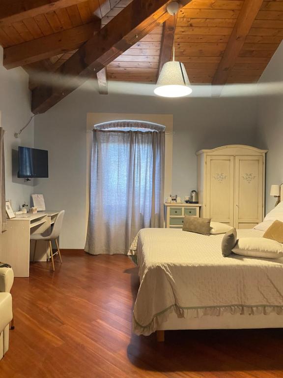 Postel nebo postele na pokoji v ubytování Locanda De Banchieri