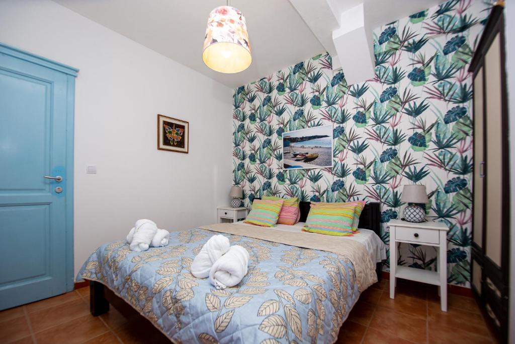 Postel nebo postele na pokoji v ubytování Apartments AriaSana-5m from the beach