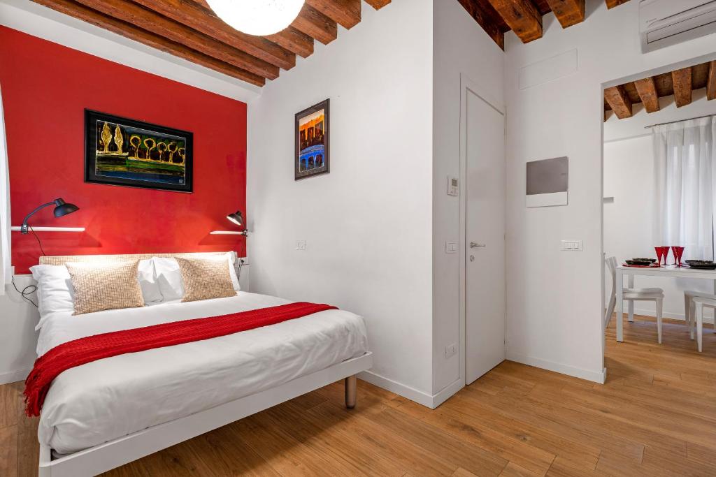 Posteľ alebo postele v izbe v ubytovaní Ca' dell'Arciere Apartments