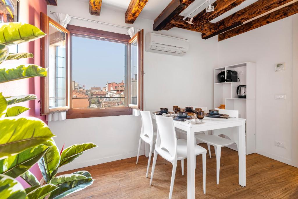 Televízia a/alebo spoločenská miestnosť v ubytovaní Ca' dell'Arciere Apartments